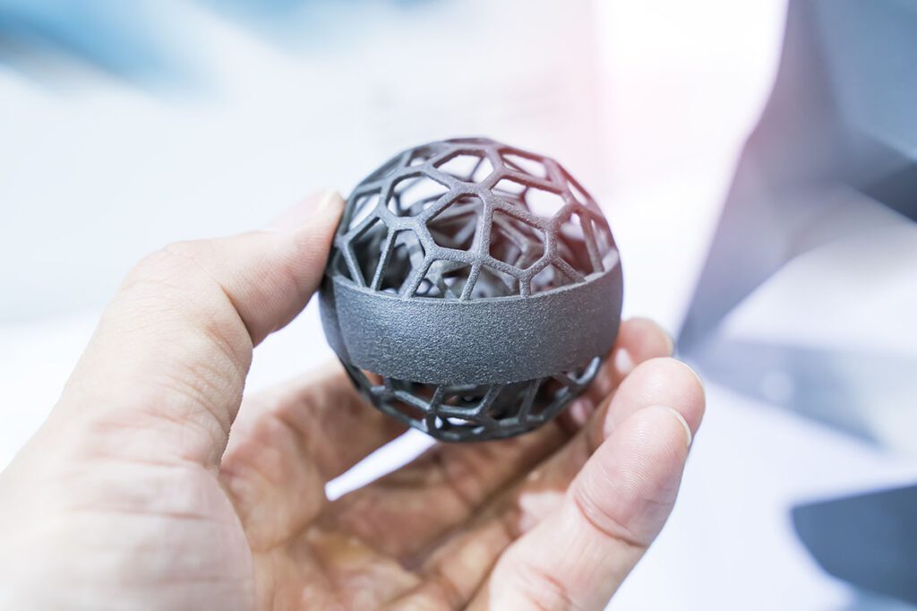 A close-up of a 3D-printed component featuring a complex lattice structure, highlighting the intricate geometries achievable through additive manufacturing techniques.